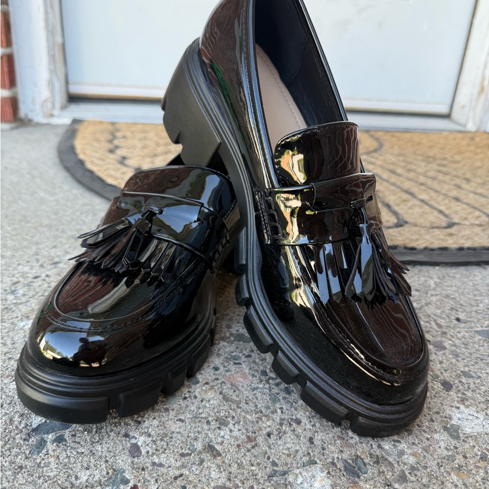 Shiny Black Loafers with Fringe Detail